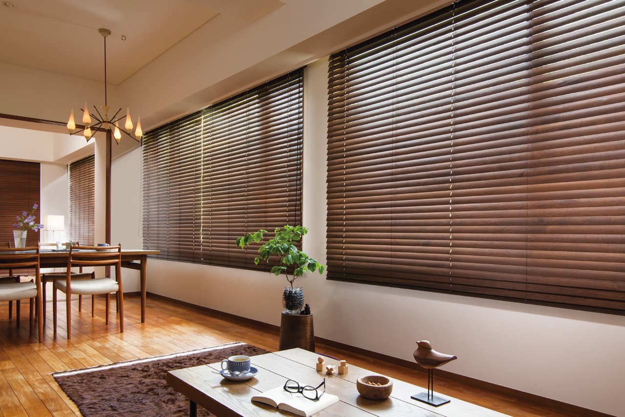 Pacific Bay Blinds & Shades team installing custom wood blinds in a Bay Area living room Pacific Bay Blinds & Shades team installing custom wood blinds in a Bay Area living room